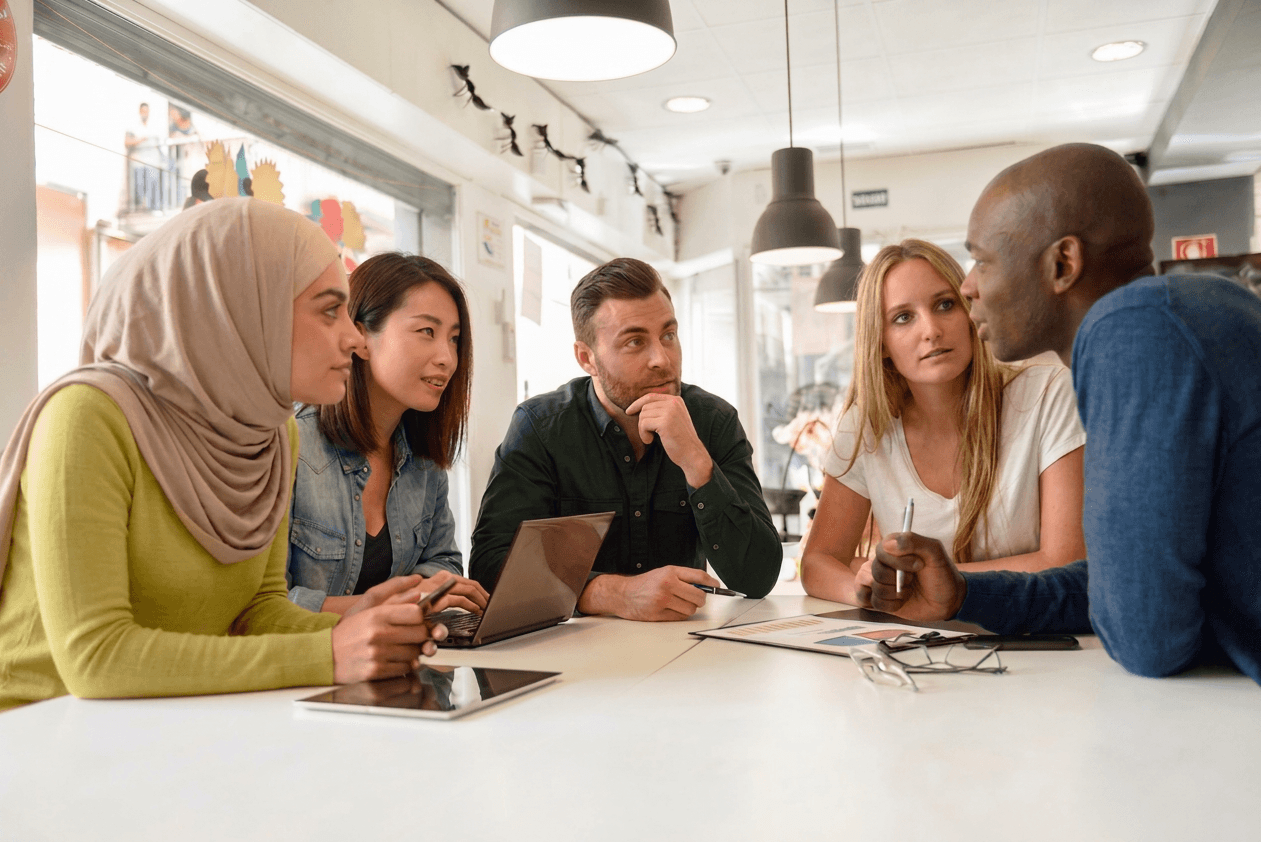 Founder and investor group reviewing a funding plan